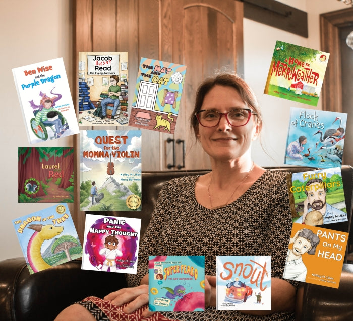 Kelley M Likes sitting on a couch with children's books displayed around her