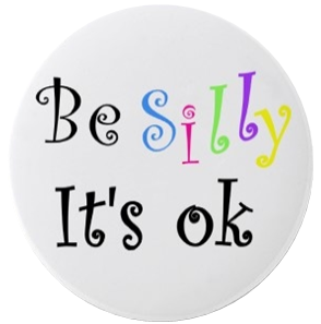 Round white button with colorful text 'Be Silly It's ok' on a white background